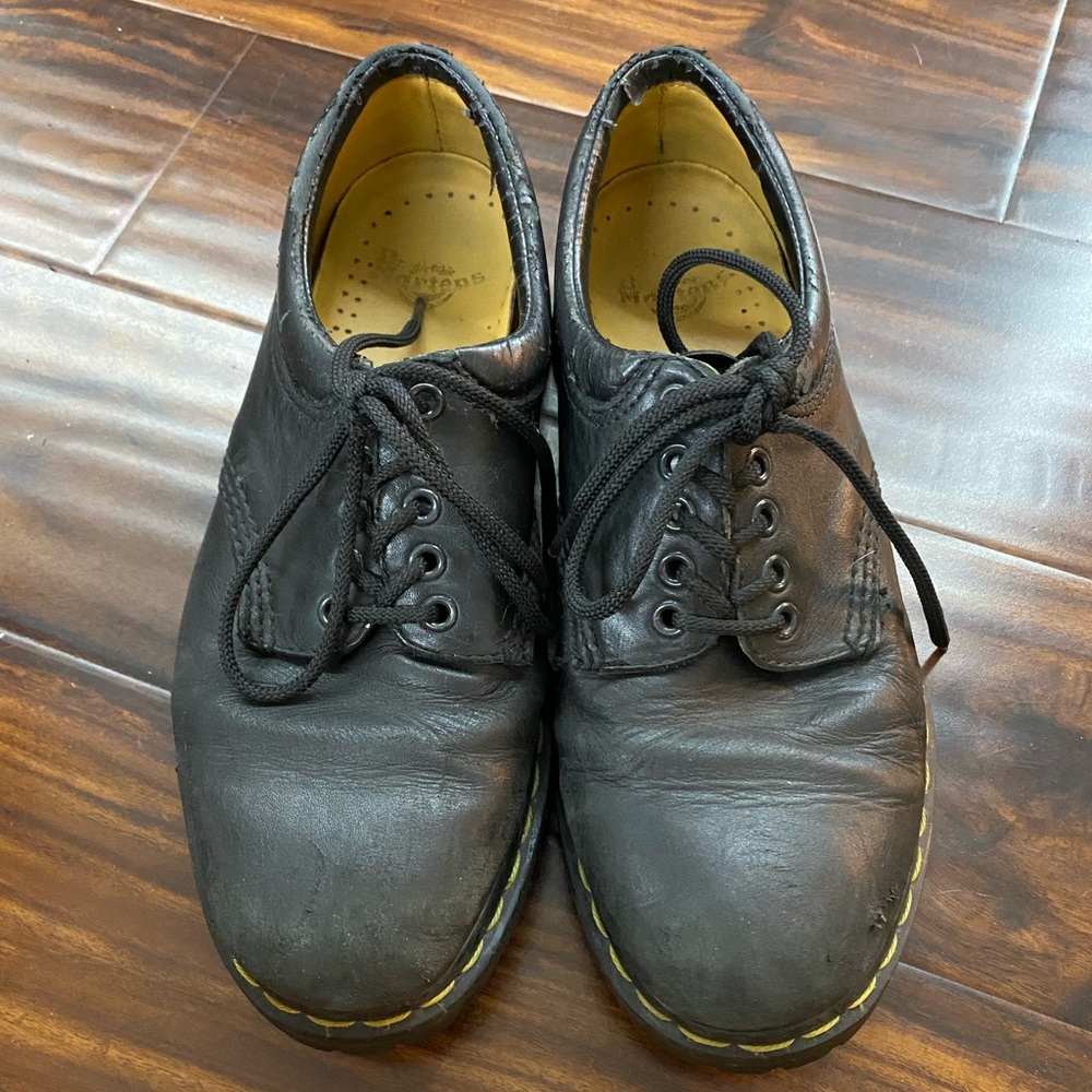Dr. Marten’s black leather shoes